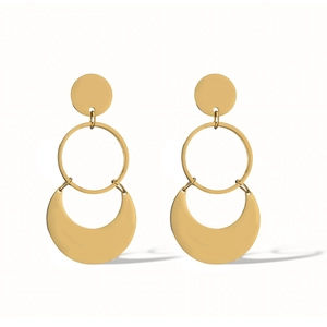 Detail view of gold geometric titanium earrings with crescent and circular charms