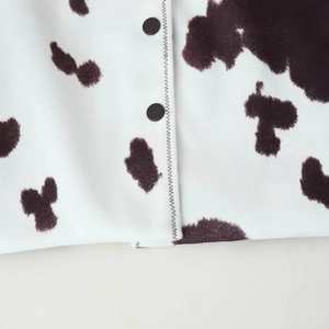 Women's casual button-up cardigan with brown cow print pattern and soft knit texture