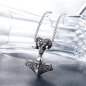 Vintage Mjölnir pendant with ram head and Viking carvings on a steel box chain