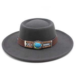 Detail of grey wide-brim wool fedora with bohemian leather band and turquoise stone