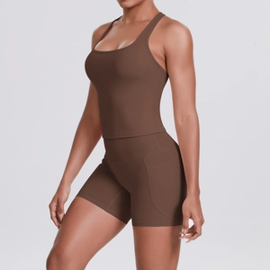 Close-up of deep brown yoga set with functional side pockets and matte stretch fabric