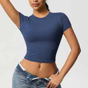 Detail of slim-fit dark blue yoga crop top showing quick-dry fabric texture and round neck