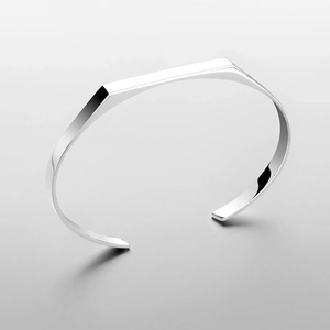 Detailed macro shot of the silver geometric multi-faceted stainless steel bangle
