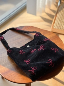 Retro black canvas underarm bag with pink bow embroidery and metallic snap button