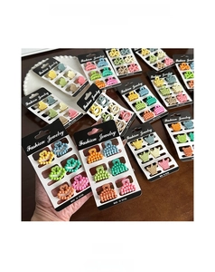 Detailed view of colorful resin mini hair clips in heart and crown shapes on cards