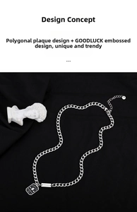 Detailed view of silver Cuban chain with Good Luck and BARDIAN engraved pendants