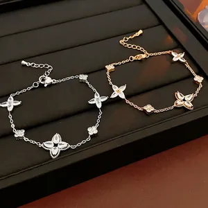 Elegant gold and silver flower bracelets with star zircon pendants on black leather