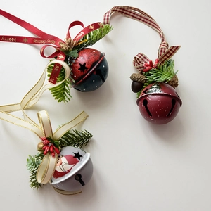Christmas metal bell ornaments with pine cones and ribbons for festive wall decoration