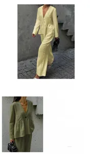 Detail of V-neck long sleeve cotton top with ruffled hem and wide-leg trousers