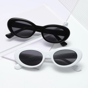 Retro oval sunglasses in classic black and white frames with a polished finish