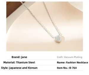 Close-up of heart pendant necklace in polished titanium steel with white zircon pavé