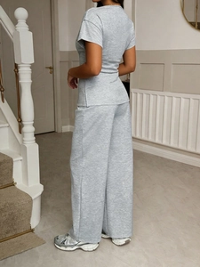 Women's grey casual two-piece set featuring short sleeve T-shirt and wide-leg trousers