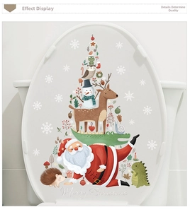 Detail of Merry Christmas toilet seat stickers with Santa Claus and snowman motifs