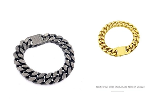 Macro shot of silver and gold thick Cuban link bracelets with rectangular clasp