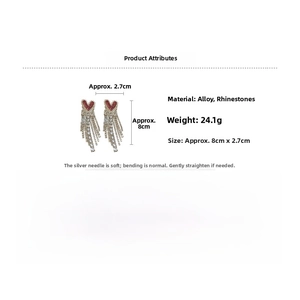 Detailed view of red heart crystal earrings with silver tassels showing size 8cm by 2.7cm