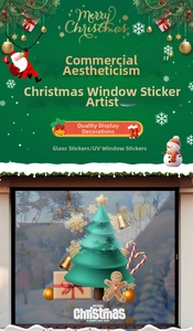 Macro view of Christmas tree and gingerbread man stickers on a glass store window