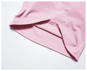Detailed macro view of pink yoga top hem with high-quality double-needle flat stitching