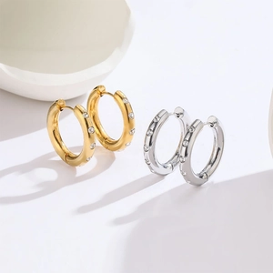 Minimalist titanium steel hoop earrings with crystal pavé in gold and silver finish