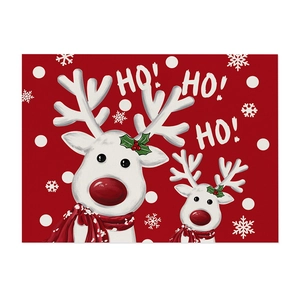 Red Christmas placemat with reindeer and snowflake print featuring HO HO HO text design