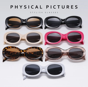 Collection of oval retro sunglasses in multiple colors with thick frames and UV protection
