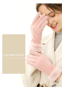 Close-up of pink cashmere gloves with thick faux fur cuffs and thermal storage detail