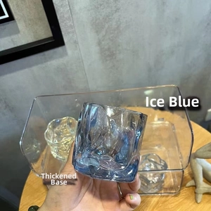 Detail of ice blue glass with irregular ripples and a thickened base for whiskey