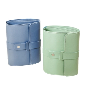 Portable leather jewelry organizer pouches in blue and green with snap button closure