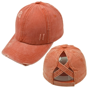 Detail of distressed ponytail baseball cap with criss-cross elastic bands in burnt orange