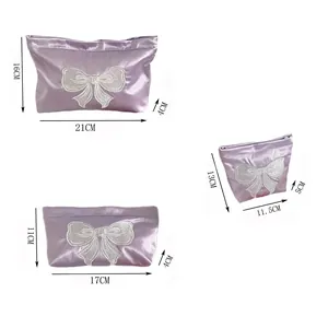 Size chart for purple satin cosmetic bags with white bow embroidery in three dimensions