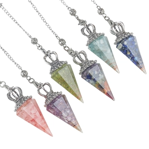 Detail view of hexagonal resin crystal pendants with crown charms and silver bead chains