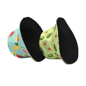 Reversible cotton bucket hat featuring vintage avocado and watermelon fruit patterns