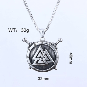 Macro shot of Viking shield pendant with Valknut symbol and crossed swords, 49x32mm size