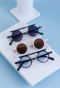 Steampunk round sunglasses with flat top bar and star rivet details in three colors