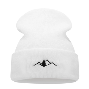 White knit beanie with black mountain and tree embroidery for outdoor winter warmth