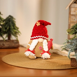 Macro shot of a Christmas gnome on a jute mat with warm holiday background bokeh