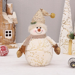 White plush Christmas snowman doll with gold branch patterns and a pointed hat for decor