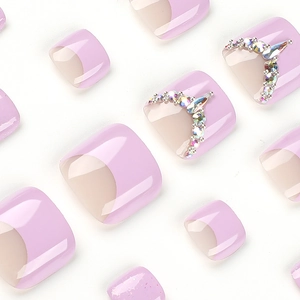 Purple French press-on toenails with glitter and rhinestones on a white background