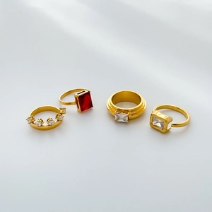 Golden titanium steel rings set with red and clear rectangular zircon stones