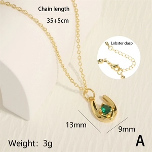 Detail view of U-shaped gold necklace with green zircon and 35+5cm chain dimensions