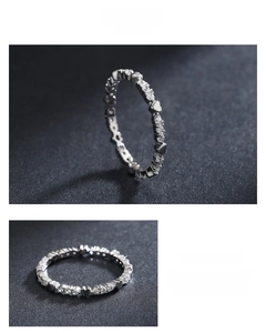 Detailed view of silver heart eternity ring with micro-pave cubic zirconia accents