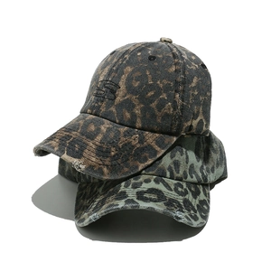 Retro leopard print baseball caps in brown and grey with washed vintage distressed details