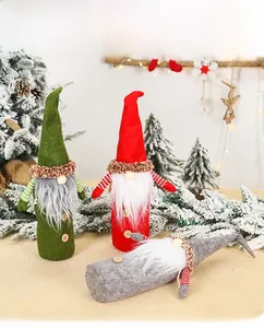 Detail of Christmas gnome wine bottle covers featuring knit fabric and wooden buttons