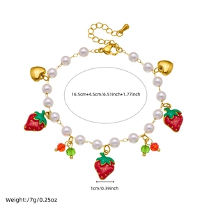Adjustable gold pearl bracelet with strawberry and heart charms for women