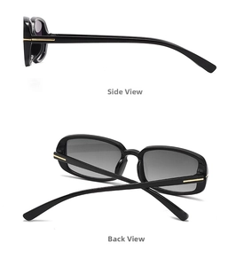 Detail view of T-shaped gold hinges on vintage black rectangle sunglasses with gray lenses