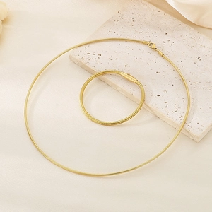 Detail of 18K gold plated stainless steel snake chain necklace and bracelet set
