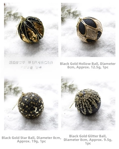 Detail of 8cm black and gold Christmas baubles with sequins, glitter and star patterns
