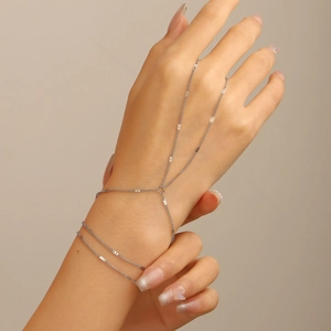 Minimalist silver multi-layer hand chain bracelet with sequins on female model