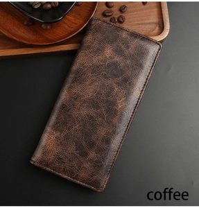 Detail of vintage coffee brown long wallet for men with textured leather finish