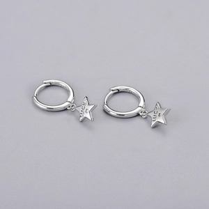 Detail of silver S925 sterling silver hoop earrings with star pendants and Lucky engraving