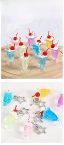 Close-up of assorted cream glue sundae drink keychains with star-shaped metal hooks